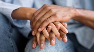 A close up of a couple holding hands for Wellview Counseling. This could represent consent between partners. Teen counseling in Roswell, GA can help young adults better cope with sexual assault. Learn more about trauma therapy in Atlanta, GA today! 30076