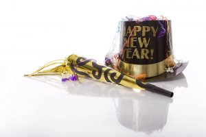 A close up of a hat and streamers that reads "happy new year!" Online therapy in Atlanta, GA can offer support in 2022. Contact a therapist in Roswell, GA to learn more about our services today! 30076