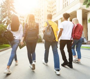 A group of college students walk together to their next class on a sunny day. This could represent the connection that comes from completing young adult therapy in Roswell, GA. Contact a young adult therapist in Roswell, GA to learn more about anxiety counseling near me and other services! 30076 
