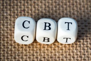 Photo of the words CBT spelled out with cubes. This photo represents how CBT and DBT therapy are related.